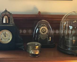 A rare antique skeleton clock, a Gilbert mantle clock, a Seth Thomas brass clock with bell, and a Horolovar Plato clock