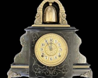 Gilbert Bell Top Mantle Clock with 8 day time and half hour strike, in a wooden case with incised and faux marble decoration.