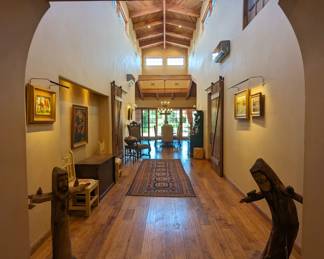 A magnificently curated collection blending contemporary art, antique furniture, high end pieces, exclusive furnishings. 