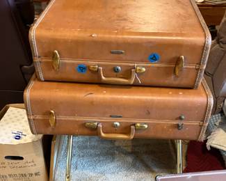 Vintage suitcases on luggage rack