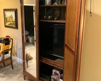 Late 19th century French double door armoire with brass ormolu and beveled glass mirrors
