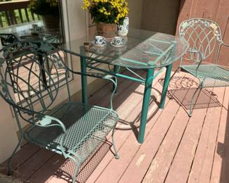 Wrought iron chairs and green patio table that goes with 4 chairs