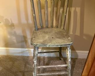 Antique junior chair with peeling paint