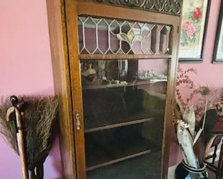 single glass door antique bookcase cabinet on hoof feet and stained glass.  unique carvings