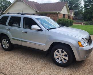 Taking bids on 2010 Grand Jeep Cherokee with 5k original miles on it. Mint shape !