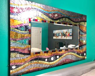 Beautiful mosaic framed mirror .