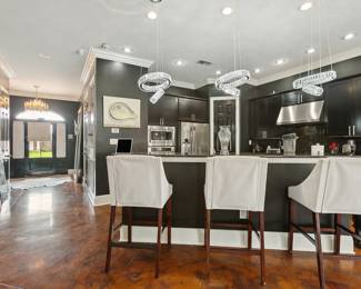 The view facing the front door and kitchen.