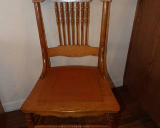 Dining chairs have leather seat accents 