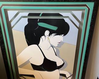 Patrick Nagel serigraph has a crack in the glass. 