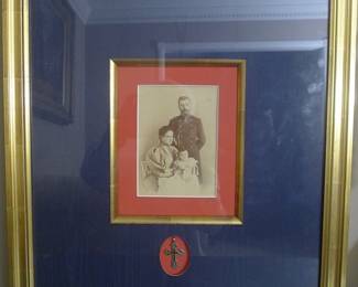 Photo of Tzar Nicholas 11 by the Palace Photographer with the Alexandra and their first child  