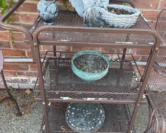 . . . cute wrought-iron cart with planters