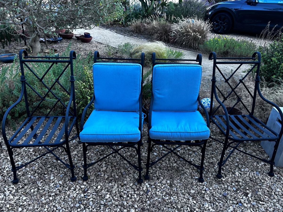 outdoor wrought iron chairs - excellent condition - w frontgate cushions for all 4 chairs - also in very good condition.