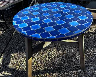 outdoor table with tile and wood legs
42" round crate and barrel