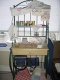 Baker's rack & new jar candles...also, many hand embroidered linens.