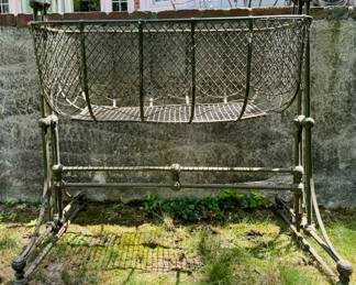 GREAT outdoor items - here is an antique iron baby crib