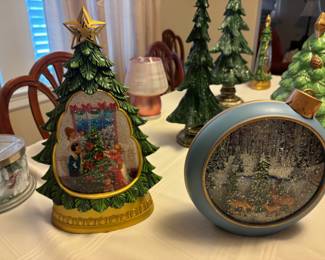 Several animated diorama snow globes 