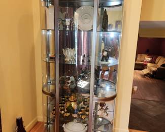 lighted, 5 shelf curio cabinet.  ( NOT ALL ITEMS INSIDE ARE FOR SALE. Measures 78" tall x 44" wide
