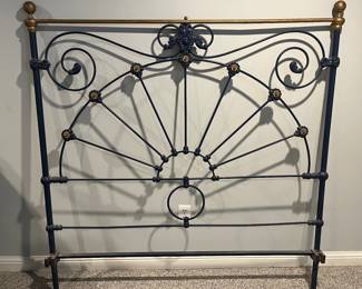 Lower Level:  A very heavy antique iron headboard has a coordinating footboard as shown in the next photo.  It looks black but it is actually a very dark blue with gold.