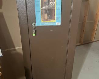 Lower Level:  A quality HOMAK No. 3000 Home Security Gun Safe includes its original tag.  The next photo shows the interior.