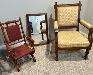 Lower Level:  A wooden frame mirror is flanked by a  child's antique platform rocker and a Victorian Eastlake chair.  (The platform rocker is missing the bell on the left stile.)  