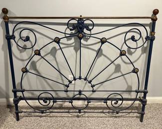 Lower Level:  This is the footboard of the heavy antique cast iron bed.