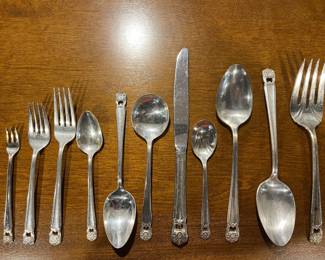 Lower Level:  This is a beautiful set of F.B. Rogers "Eternally Yours" silverplate.  The entire 93 piece set includes:  11 salad/dessert forks; 12 dinner forks; 12 dinner knives; 9 cocktail forks; 10 tablespoons; 11 butter knives; 21 teaspoons; 3 soup spoons; 1 sugar spoon; and three serving pieces. 