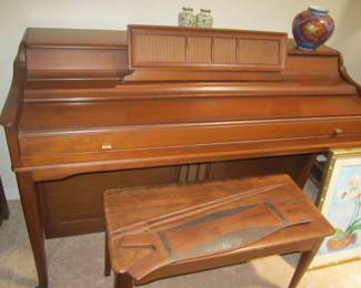 Wurlitzer upright piano - African shield on bench