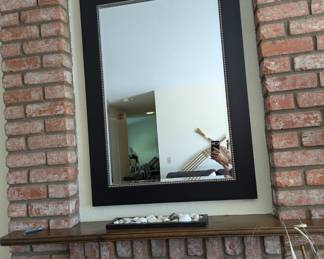 It's a mirror !! I wasn't thinking when I snapped this photo all see is brick! Oh aand my arm stretched out to get the picture !! Did you zoom in????