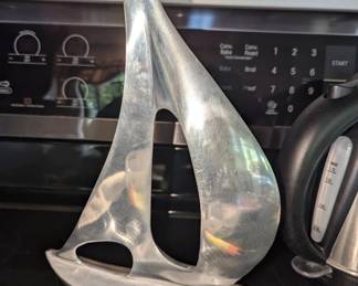 This is my kinda sail boat .. no motion sickness with this one ! 

Sailboat Sculpture 16.5" Aluminum Silver Metal Polished Nautical Home Decor India