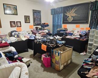 Master Bedroom full of all Linens, Clothes and More. 