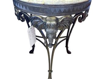 Cast iron accent table with marble top and elephants cared on legs