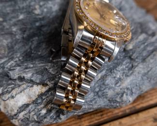 An Oyster Perpetual Datejust lady's bracelet watch. With an 18k yellow gold and diamond bezel, synthetic sapphire crystal, and a Rolex Oyster Perpetual certified chronometer automatic movement with date. Fitted with a stainless steel and 18k yellow gold Jubilee bracelet. Total weight 53.52 grams. Comes with official assessment paperwork from Pacific Gemological Laboratory INC.