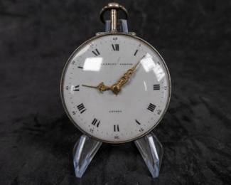 A silver pocket watch with an enamel face with both Roman and Arabic numerals. Made by Eardley Norton of London, circa late 18th Century. Both the watch face and back of the movement are signed "Eardley Norton London". No key.