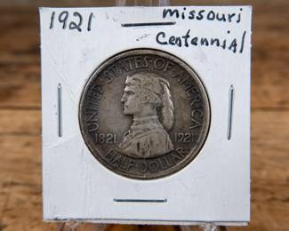 A 1921 50C Missouri Centennial commemorative half-dollar. Estimated XF condition.