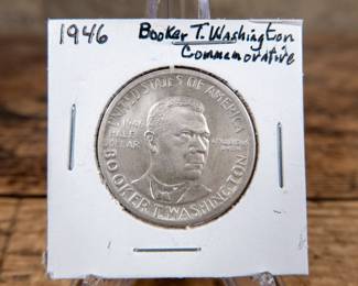 A 1946 50C Booker T. Washington commemorative half-dollar. Great details. Estimated UNC condition.