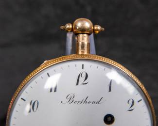 A 14k gold body pocket watch with an enamel face and Arabic numerals. Made by watchmaker Louis Berthoud of Paris in the early 1800's. This watch features a unique hidden erotic automaton scene on the back of the watch case. The face and back of the movement are both marker "Berthoud A PARIS". No key.