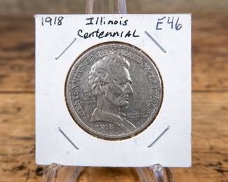 A 1918 50C Illinois Centennial commemorative half-dollar. Estimated XF condition.