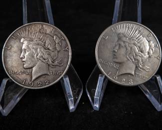 1922 Peace Dollar in XF condition minted in Philadelphia, and a 1923 S Peace Dollar in XF condition minted in San Francisco.
