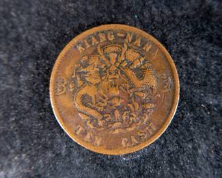 1903 20 Cash Hu-Poo, Empire of China - Qing Dynasty, 1905 Ten Cash, China - Kiangnan Province, 1887 1/2 Sen, Japan, and a 1887 1/2 Sen, Japan.
