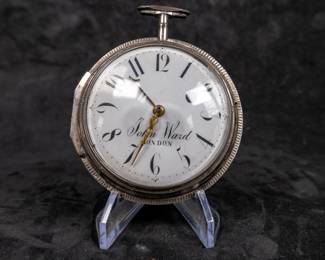 A silver pocket watch with an enamel face and Arabic numerals signed on the face "John Ward LONDON", made by watchmaker John Ward of London, late 18th Century. The movement on the back is signed "John Ward Fore Street London" Number 2640. The back movements shows a monogram of King George III, with two "G"s one reversed, and the Roman numerals III with a crown affixed on top.