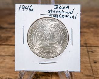 A 1946 50C Iowa Centennial commemorative half-dollar. Excellent luster and details. Estimated high UNC condition.