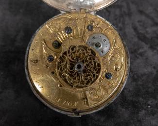 A silver pocket watch with an enamel face with both Roman and Arabic numerals. Made by Eardley Norton of London, circa late 18th Century. Both the watch face and back of the movement are signed "Eardley Norton London". No key.
