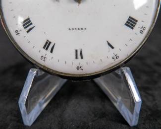 A silver pocket watch with an enamel face with both Roman and Arabic numerals. Made by Eardley Norton of London, circa late 18th Century. Both the watch face and back of the movement are signed "Eardley Norton London". No key.