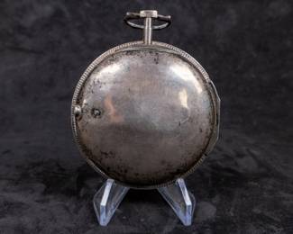 A silver pocket watch with an enamel face and Arabic numerals signed on the face "John Ward LONDON", made by watchmaker John Ward of London, late 18th Century. The movement on the back is signed "John Ward Fore Street London" Number 2640. The back movements shows a monogram of King George III, with two "G"s one reversed, and the Roman numerals III with a crown affixed on top.