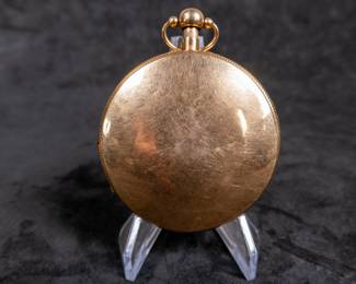 A 14k gold body pocket watch with an enamel face and Arabic numerals. Made by watchmaker Louis Berthoud of Paris in the early 1800's. This watch features a unique hidden erotic automaton scene on the back of the watch case. The face and back of the movement are both marker "Berthoud A PARIS". No key.
