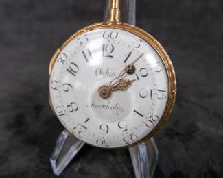 An 18K gold pocket watch with an enamel face with both hour and minute Arabic numerals. Made by watchmaker Carl Erick Orbin of Stockholm Sweden. Circa late 1700's. The back of the movement is engraved "Carl Er. Orbin", "Stockholm", and "No. 188". No key.