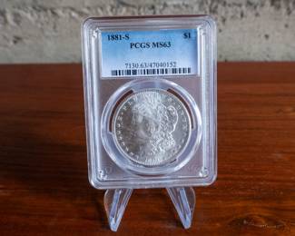 This lot features a 1881-S Morgan Silver Dollar PCGS MS63.