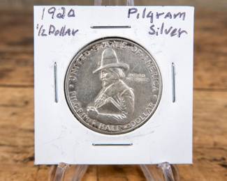 A 1920 50C Pilgrim Tercentenary commemorative half-dollar. Estimated AU condition.