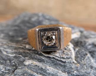 A men's 14k gold diamond ring with a single center set diamond. Made by Kaspar & Esh. Gold and diamonds have both been tested. Total weight 9.44 grams. Size 10.5