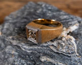 A men's 14k gold diamond ring with a single center set diamond. Made by Kaspar & Esh. Gold and diamonds have both been tested. Total weight 9.44 grams. Size 10.5